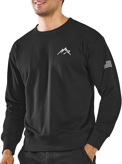 A black crewneck sweatshirt featuring a small white mountain logo on the chest and a subtle flag detail on the right sleeve, worn by a male model.